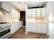 Bright kitchen featuring white cabinetry, modern appliances, and a stylish backsplash at 1501 Clairmont Rd # 1818, Decatur, GA 30033