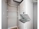 Compact laundry area with a stacked washer and dryer, maximizing space efficiency at 1501 Clairmont Rd # 1818, Decatur, GA 30033
