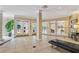 Sun-filled lobby features tile floors, potted plants, glass doors, and neutral colors at 1501 Clairmont Rd # 1818, Decatur, GA 30033