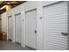 Row of well-maintained self-storage units with secure roll-up doors and unit numbers at 1501 Clairmont Rd # 1818, Decatur, GA 30033