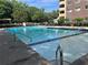 Relaxing community pool with sparkling blue water, lounge chairs and a view of the surrounding landscape at 1501 Clairmont Rd # 1818, Decatur, GA 30033