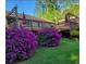 Inviting back deck featuring beautiful blooming bushes and privacy, perfect for outdoor entertaining at 1760 Commonwealth Trl, Cumming, GA 30041
