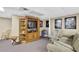 Finished basement area with carpeting, an entertainment center, and movie-themed decorations, perfect for recreation at 1760 Commonwealth Trl, Cumming, GA 30041