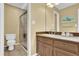 Modern bathroom with glass shower, granite countertop, and updated fixtures at 1760 Commonwealth Trl, Cumming, GA 30041