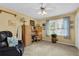 Versatile room featuring a workspace, natural light, and comfortable seating area at 1760 Commonwealth Trl, Cumming, GA 30041
