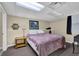 Basement bedroom featuring cozy carpeting, a bed with a plush purple cover, and ambient lighting for relaxation at 1760 Commonwealth Trl, Cumming, GA 30041