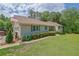 Attractive home featuring a well-maintained lawn, tidy shrubbery, and inviting curb appeal at 1760 Commonwealth Trl, Cumming, GA 30041