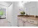 Bathroom featuring a vanity with tan counter tops and a shower behind a white curtain at 1045 Westcroft Ln, Roswell, GA 30075