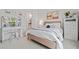 Stylish bedroom featuring vanity area, light hardwood floors, neutral walls, and modern decor at 1045 Westcroft Ln, Roswell, GA 30075