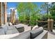 Spacious outdoor deck with comfortable seating, patio table and wooded views at 1045 Westcroft Ln, Roswell, GA 30075