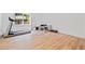 Bright workout room with treadmill, weight bench, and large window at 1045 Westcroft Ln, Roswell, GA 30075