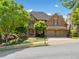 Charming two-story brick home with manicured landscaping and a two-car garage at 1045 Westcroft Ln, Roswell, GA 30075