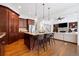 Open kitchen with a granite island, stainless appliances, and seating provides ample space for cooking at 1045 Westcroft Ln, Roswell, GA 30075