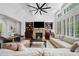 Cozy living room with a stone fireplace, built-in shelves, and comfortable seating at 1045 Westcroft Ln, Roswell, GA 30075