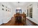 Elegant formal room featuring hardwood floors, wainscoting, and a grand piano at 1045 Westcroft Ln, Roswell, GA 30075