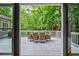 Spacious back deck with outdoor dining area and views of the surrounding trees at 1250 Northcliff Trce, Roswell, GA 30076