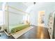 bedroom with high ceilings, hardwood floors, and a wooden frame single bed at 1250 Northcliff Trce, Roswell, GA 30076