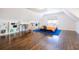 Bedroom with desk and bookshelves on hardwood floors with a blue rug at 1250 Northcliff Trce, Roswell, GA 30076