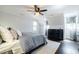 Spacious bedroom with hardwood floors, a ceiling fan, and large windows with natural light at 1250 Northcliff Trce, Roswell, GA 30076