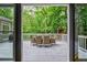 Spacious deck with outdoor dining furniture, perfect for entertaining with peaceful views of the wooded yard at 1250 Northcliff Trce, Roswell, GA 30076