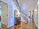 Foyer with hardwood floors, a staircase, and view into other rooms at 1250 Northcliff Trce, Roswell, GA 30076