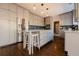 Kitchen with gray cabinets, stainless steel refrigerator, pendant lighting, and hardwood floors at 1250 Northcliff Trce, Roswell, GA 30076