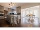 Open-concept kitchen with island, stainless steel appliances, and views of the sun-filled dining room at 1250 Northcliff Trce, Roswell, GA 30076