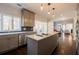 Updated kitchen with stainless steel appliances, island with bar seating, and an open layout at 1250 Northcliff Trce, Roswell, GA 30076