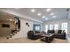 This living room has carpeting and features a stairwell to a wet bar at 1250 Northcliff Trce, Roswell, GA 30076