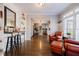 Open living space featuring hardwood floors, built-in shelving, bar seating, and natural light at 1250 Northcliff Trce, Roswell, GA 30076