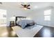 Spacious main bedroom with dark hardwood floors, ceiling fan, and ensuite bathroom access at 1250 Northcliff Trce, Roswell, GA 30076