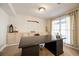 Office with carpet, a large desk, built-in shelving and curtains at 1250 Northcliff Trce, Roswell, GA 30076