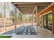 This covered patio has a concrete area with pea gravel and a walkway at 1250 Northcliff Trce, Roswell, GA 30076