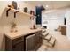 The wet bar features wood cabinets, a mini fridge and overlooks living area at 1250 Northcliff Trce, Roswell, GA 30076