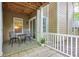 View of covered patio area with tile floor, patio furniture, and privacy fence at 2120 River Heights Se Walk, Marietta, GA 30067