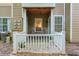 Cozy covered condo patio with fenced in rails, furniture, tile floor, and an exterior storage closet at 2120 River Heights Se Walk, Marietta, GA 30067
