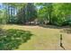 Large community yard with a clear view of the pool, trees, and the landscape surrounding the homes at 2120 River Heights Se Walk, Marietta, GA 30067