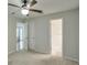 This bedroom features carpeted floors, a ceiling fan, and two doors at 2120 River Heights Se Walk, Marietta, GA 30067