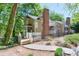 Stacked condo building with multiple patios and fenced yard overlooking tree-filled surrounding area at 2120 River Heights Se Walk, Marietta, GA 30067