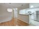 Bright kitchen with white cabinets, granite countertops, stainless steel appliances, and open dining area at 2120 River Heights Se Walk, Marietta, GA 30067