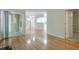 Open-concept living area featuring hardwood floors, sliding glass doors, and access to the kitchen at 2120 River Heights Se Walk, Marietta, GA 30067