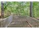 Outdoor patio area surrounded by lush greenery and trees, offering a private and serene outdoor space at 2120 River Heights Se Walk, Marietta, GA 30067