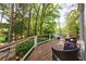 Expansive wooden back deck with outdoor seating and a serene view of the surrounding greenery at 2840 Alpine Rd, Atlanta, GA 30305