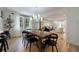 Spacious dining room with modern lighting fixture, and an open layout to adjacent living area at 2840 Alpine Rd, Atlanta, GA 30305