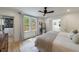 Light-filled main bedroom with hardwood floors, ceiling fan, and a large walk-in closet at 2840 Alpine Rd, Atlanta, GA 30305