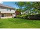 Spacious backyard with a wooden fence and lush lawn at 5679 Windfall Ln, Lithonia, GA 30058