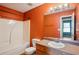 Bright bathroom with a shower and tub combo, ample lighting, and vanity at 5679 Windfall Ln, Lithonia, GA 30058