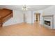 Bright, open living space with a fireplace and hardwood floors at 5679 Windfall Ln, Lithonia, GA 30058