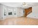 Bright and airy living room with light wood floors and large windows at 5679 Windfall Ln, Lithonia, GA 30058