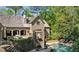 Scenic view of the backyard with a pool, greenery, and brick details at 105 Kingston Mnr, Atlanta, GA 30342